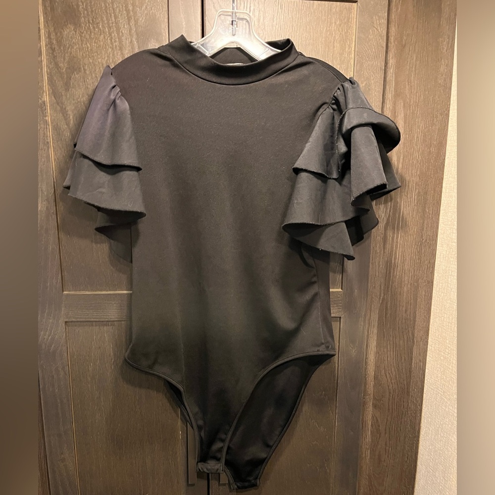 Black ruffle sleeve body suit.